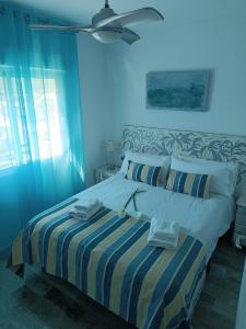 Posteľ alebo postele v izbe v ubytovaní Benal Beach 907 + 37 fotografií