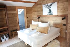 Łóżko lub łóżka w pokoju w obiekcie Villa Forêt et Spa