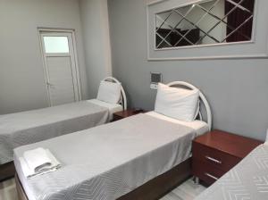 Postel nebo postele na pokoji v ubytování YASİN OTEL