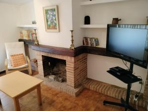 Televízia a/alebo spoločenská miestnosť v ubytovaní La Casa de Alicio en Moronta Salviva