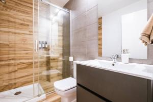 a bathroom with a toilet and a sink and a shower at Casa San Miguel Terrace - Centro Zaragoza in Zaragoza