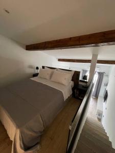 a bedroom with a large bed in a room at Art Studios Gialova Navarino in Gialova