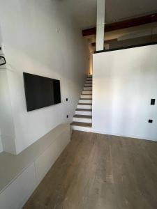 TV a/nebo společenská místnost v ubytování Art Studios Gialova Navarino