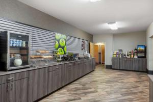 a fast food restaurant with a counter in a room at La Quinta by Wyndham Fairbanks Airport in Fairbanks
