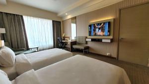 En eller flere senge i et værelse på Radisson Blu Hotel, Greater Noida