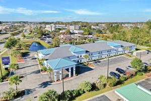 an aerial view of a resort with a parking lot at Baymont by Wyndham North Myrtle Beach in Myrtle Beach