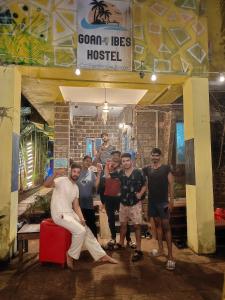 a group of people posing for a picture at a hotel at The goanvibes hostel and cafe in Anjuna