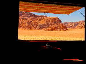 a view of the desert from a window of a vehicle at Wadi rum view camp in Wadi Rum