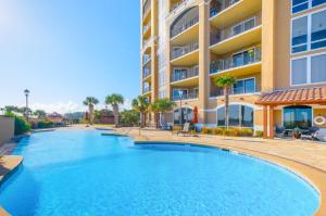 a large swimming pool in front of a building at Sienna 1103 in Gulfport