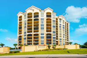 a large apartment building with a blue sky in the background at Sienna 1103 in Gulfport