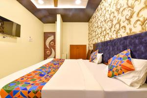 Ένα ή περισσότερα κρεβάτια σε δωμάτιο στο FabHotel Spark