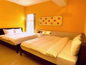 A bed or beds in a room at 安蘭居旅店 An Lan Jie Hotel