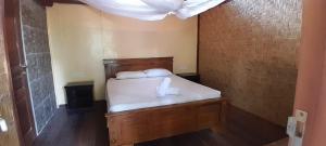 Postel nebo postele na pokoji v ubytování Bidara Cottage