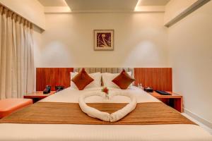 Voodi või voodid majutusasutuse Hotel Hari Govindas Mysore - Explore the Heart of Mysore toas