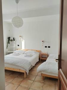 Ένα ή περισσότερα κρεβάτια σε δωμάτιο στο Hommy Lab - stylish and modern with super kitchen, separate entrance, free parking
