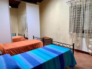 En eller flere senge i et værelse på Il Casale - tra Passato e Modernità