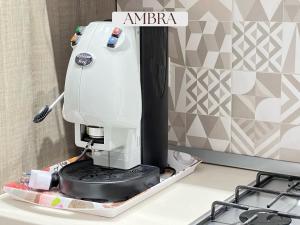 a white sewing machine sitting on top of a counter at Residence Lori in Brindisi