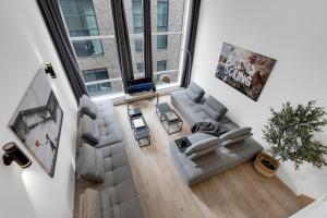 an overhead view of a living room with a couch at LiV MTL Downtown Montreal Spacious Suites in Montreal