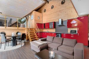 a living room with a couch and a table at Atlantic Road Seaside Housing in Averoy +56 photos