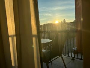 a view of the sunset from a balcony at Vila Drina Apartments in Banja Koviljača