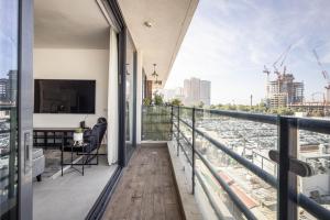 a balcony with a view of a city at HaCarmel Market Vibrat Apartment by Sea N' Rent in Tel Aviv