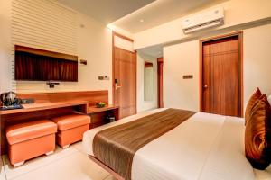 Voodi või voodid majutusasutuse Hotel Hari Govindas Mysore - Explore the Heart of Mysore toas