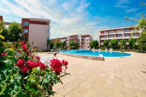 a resort with a swimming pool and some buildings at Nessebar Fort Club Apartments in Sunny Beach