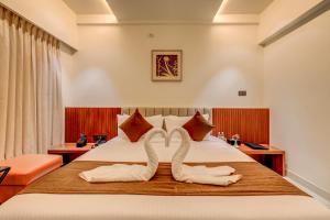 Voodi või voodid majutusasutuse Hotel Hari Govindas Mysore - Explore the Heart of Mysore toas