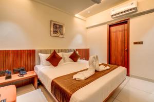 Voodi või voodid majutusasutuse Hotel Hari Govindas Mysore - Explore the Heart of Mysore toas