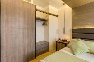 a bedroom with a bed and a walk in closet at Warmthotel in Rome