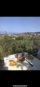 a table with plates of food on top at Casa rural entre la naturaleza Gomera in El Cercado