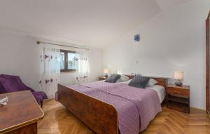 Postel nebo postele na pokoji v ubytování Apartmani Katalin