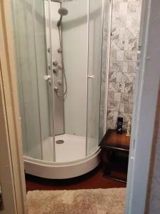 a shower with a glass door in a bathroom at Hotels in Orhei