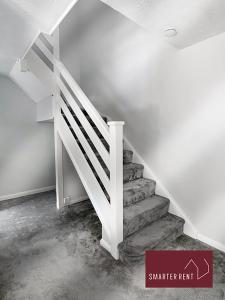 a staircase in a room with a white stair railing at Finchampstead, 1 Bedroom House with garden in Finchampstead