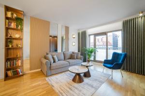 a living room with a couch and a table at Drim Apartaments in Gdańsk