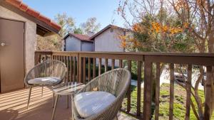 two chairs and a table on a deck at Landing Modern Apartment with Amazing Amenities (ID8118X32) in Temecula
