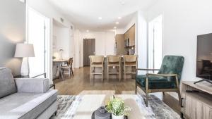 a living room with a couch and a table at Landing Modern Apartment with Amazing Amenities (ID7724X75) in South San Francisco