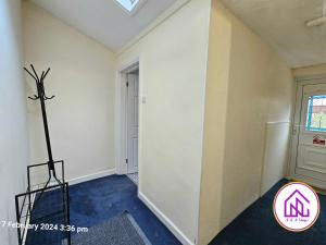 an empty room with a cross on the wall at The Clevedon Bungalow , Close to Sea Front, Great Locataion in Weston-super-Mare