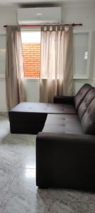 a living room with a couch and a window at SAN BERNARDO in San Bernardo