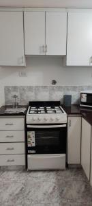 a kitchen with a stove and a sink at SAN BERNARDO in San Bernardo
