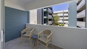 two chairs and a table on a balcony at Landing Modern Apartment with Amazing Amenities (ID3931X23) in Phoenix