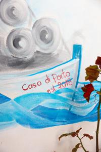 a painting of a pair of rolls of toilet paper at Casa di Porto in Neos Marmaras