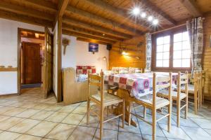 a dining room with a table and chairs at Chalet de 7 chambres avec terrasse et wifi a Saint Gervais les Bains in Saint-Gervais-les-Bains