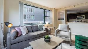 a living room with a couch and a chair at Landing Modern Apartment with Amazing Amenities (ID1593X6) in Portland