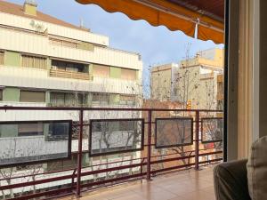 a balcony with a view of a building at Apartment Picasso in Vilanova i la Geltrú