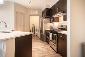 A cozinha ou cozinha compacta de Landing Modern Apartment with Amazing Amenities (ID1779X54)