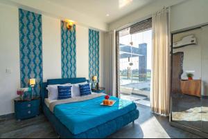 Posteľ alebo postele v izbe v ubytovaní IRIS HEAVEN'Z by Radha Rani Resort