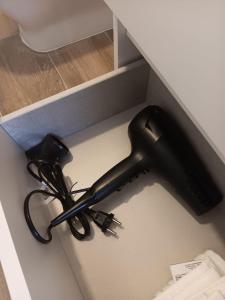 a sink with a hair dryer on a counter at Francos Rodriguez1 Apartments in Madrid