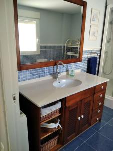 a bathroom with a sink and a mirror at 3 bedrooms apartement at Bronchales in Bronchales