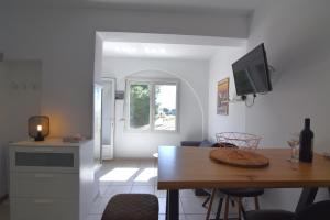 Televízia a/alebo spoločenská miestnosť v ubytovaní RNET - Casa del Sol Roses Costa Brava